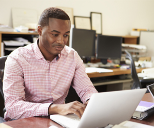 Businessman working on computer, Tax Preparation and Planning inLake City, FL and Gainesville, FL